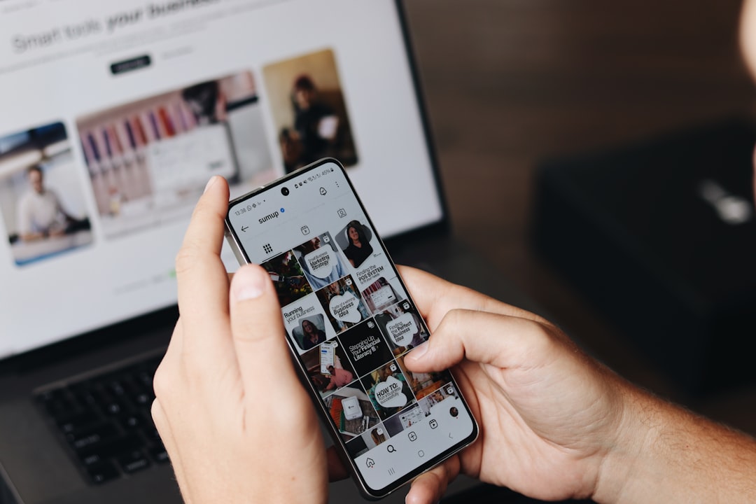 services-02 A person is using their smartphone to browse the SumUp Instagram profile, focusing on posts related to marketing strategies and business tips. In the background, a laptop displays a webpage about tools for business growth, suggesting a workspace or content creation environment. This image highlights the use of social media for brand promotion, digital marketing, and business engagement, making it relevant for content creators, marketers, and entrepreneurs.